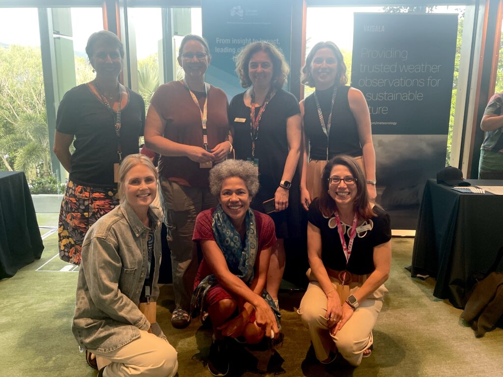 Hub Knowledge Brokers and researchers taking a group photo at AMOS 2025.