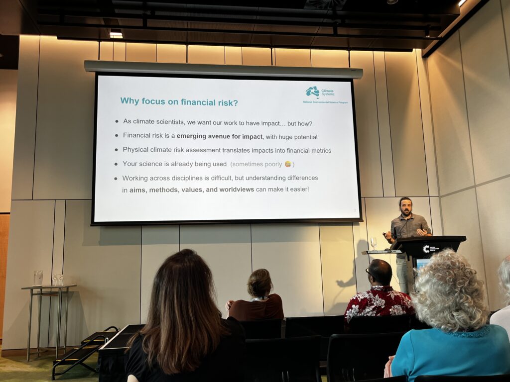 Ned Haughton presenting on financial risk at AMOS 2025.