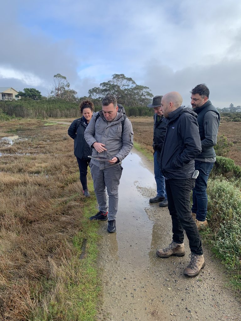 Researcher showing group of practitioners the flood maps online